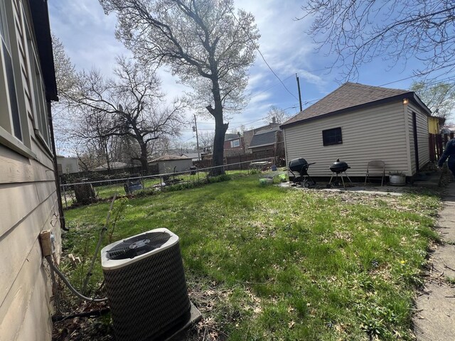 11916 S Harvard Ave, Chicago, IL 60628 - view of yard with central AC and a fenced backyard