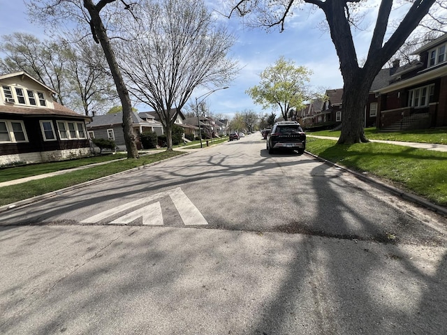 11916 S Harvard Ave, Chicago, IL 60628 - view of road featuring curbs, sidewalks, and a residential view