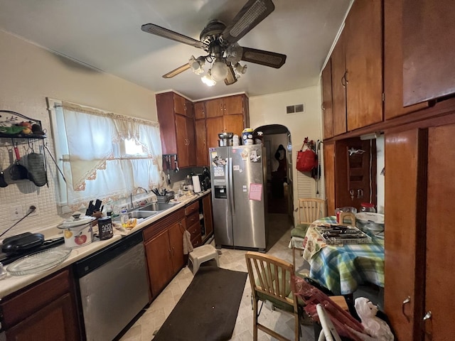 11916 S Harvard Ave, Chicago, IL 60628 - kitchen with ceiling fan, appliances with stainless steel finishes, light countertops, and a sink