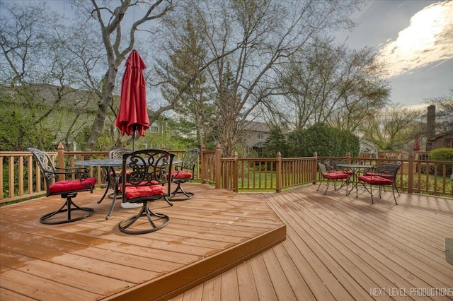 deck with outdoor dining space