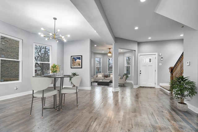 entryway featuring recessed lighting, wood finished floors, baseboards, and an inviting chandelier