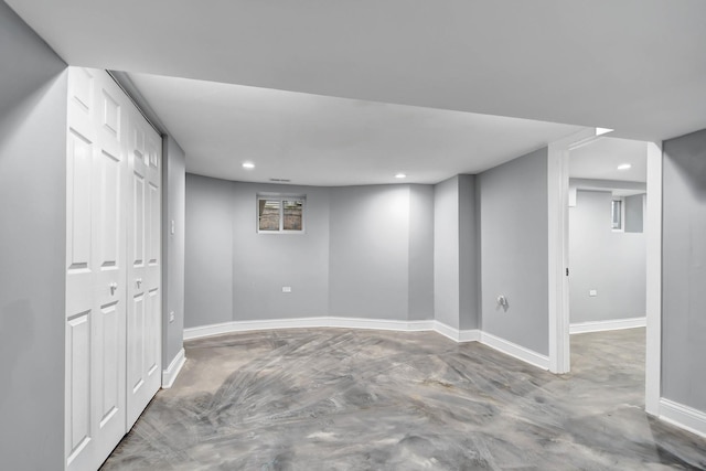 finished basement with recessed lighting and baseboards