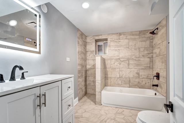 bathroom featuring toilet, recessed lighting, marble finish floor, vanity, and tub / shower combination