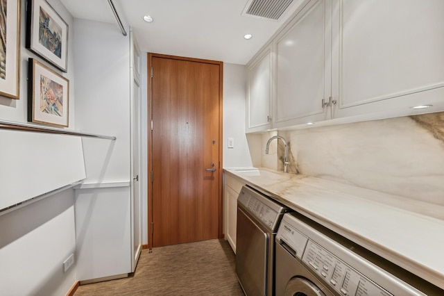 laundry area with a sink, washer and dryer, cabinet space, visible vents, and recessed lighting