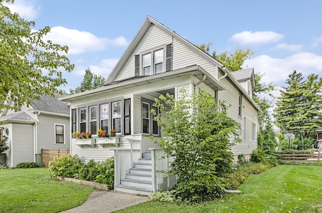 bungalow featuring a front yard