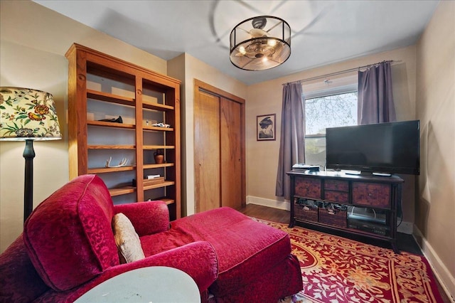 sitting room featuring wood finished floors and baseboards
