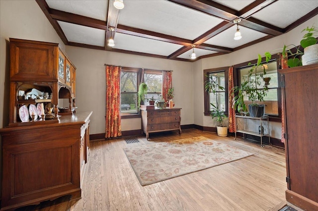 interior space with beamed ceiling, baseboards, light wood-style floors, and coffered ceiling