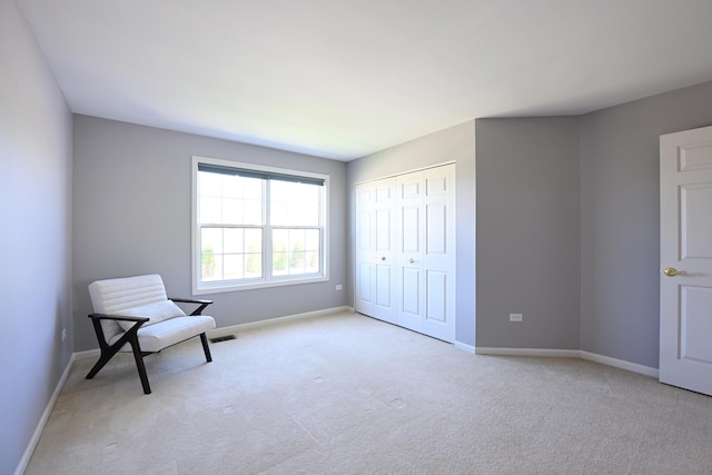 661 Bluebonnett Dr, Aurora, IL 60505 - sitting room featuring light carpet and baseboards