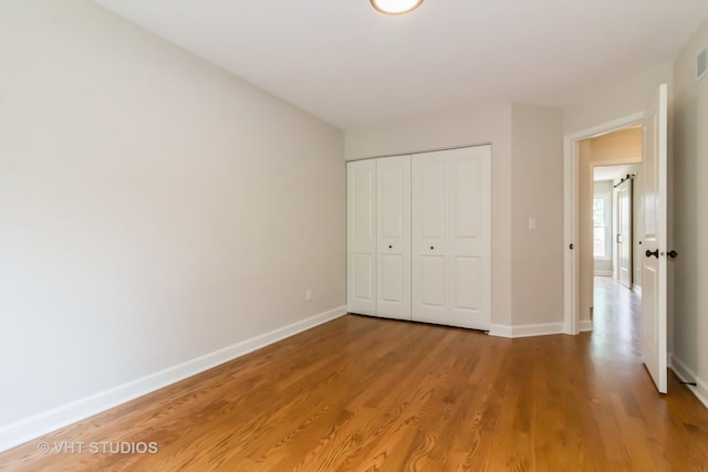 2509 Oak Trails Dr, Aurora, IL 60506 - unfurnished bedroom with light wood-type flooring and a closet