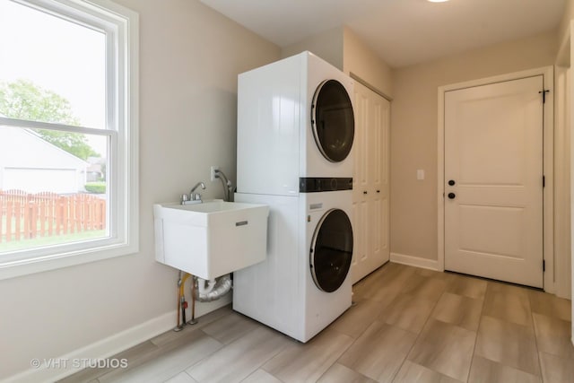 2509 Oak Trails Dr, Aurora, IL 60506 - laundry area with stacked washer / dryer and baseboards