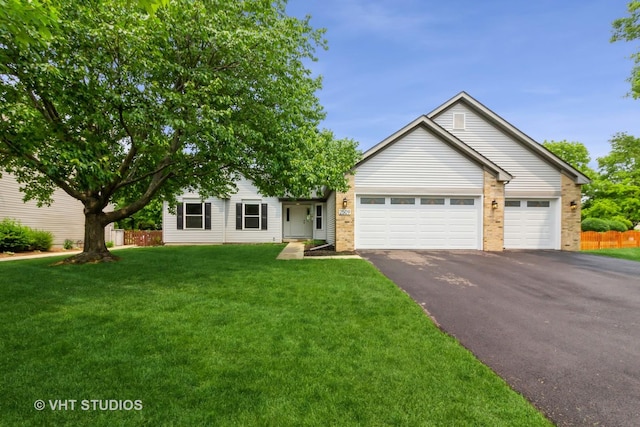2509 Oak Trails Dr, Aurora, IL 60506 - ranch-style house with asphalt driveway, an attached garage, and brick siding