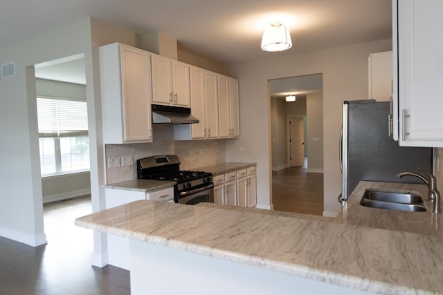 2836 Hillcrest Cir, Naperville, IL 60564 - kitchen with appliances with stainless steel finishes, a sink, under cabinet range hood, baseboards, and white cabinets