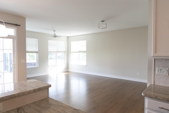 2836 Hillcrest Cir, Naperville, IL 60564 - unfurnished dining area with dark wood-style floors, baseboards, and ceiling fan