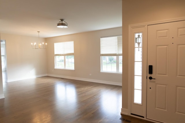 2836 Hillcrest Cir, Naperville, IL 60564 - foyer entrance featuring a chandelier, dark wood-type flooring, and baseboards