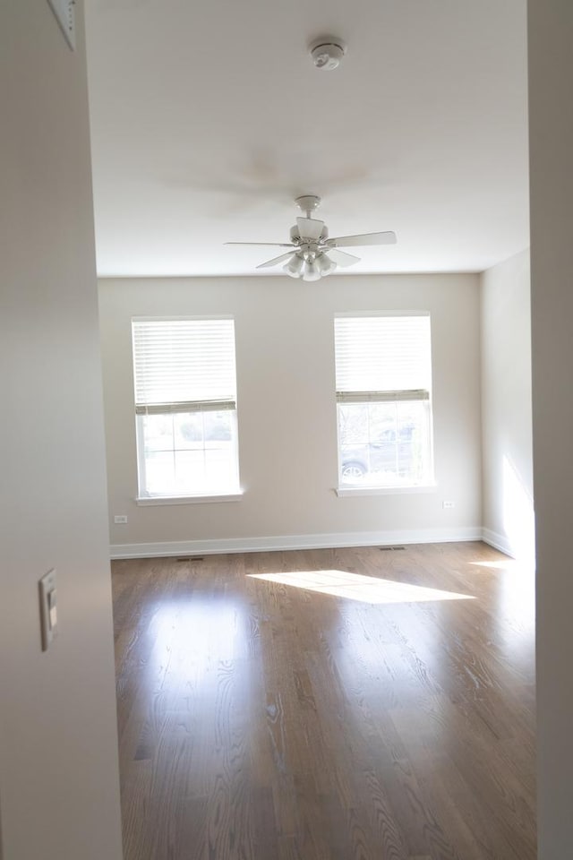 2836 Hillcrest Cir, Naperville, IL 60564 - empty room with a smoke detector, healthy amount of natural light, a ceiling fan, and baseboards