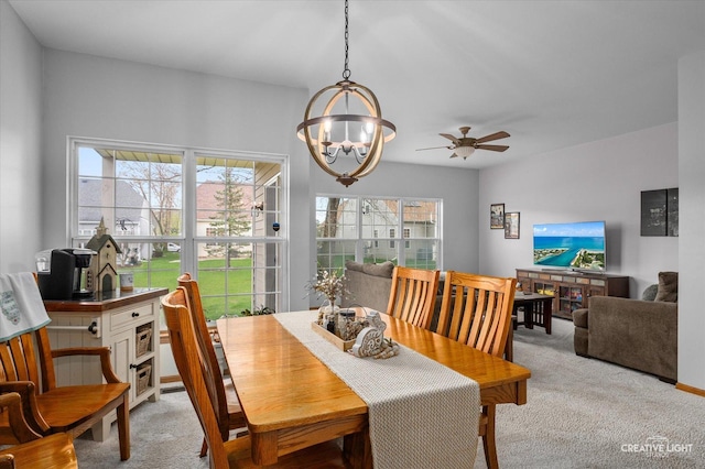 204 Fairwind Dr, Montgomery, IL 60538 - dining room featuring light colored carpet and ceiling fan with notable chandelier