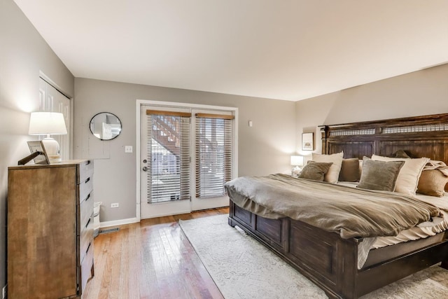 1473 N Larrabee St Unit A, Chicago, IL 60610 - bedroom with access to outside, light wood-type flooring, and baseboards