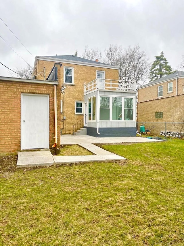 7241 N Kilpatrick Ave, Lincolnwood, IL 60712 - back of house featuring a lawn, a balcony, and brick siding
