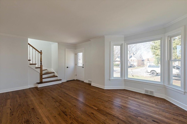7241 N Kilpatrick Ave, Lincolnwood, IL 60712 - foyer with stairs, dark wood finished floors, baseboards, ornamental molding, and visible vents
