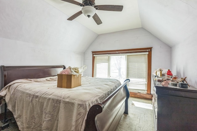 bedroom featuring lofted ceiling, ceiling fan, and light carpet