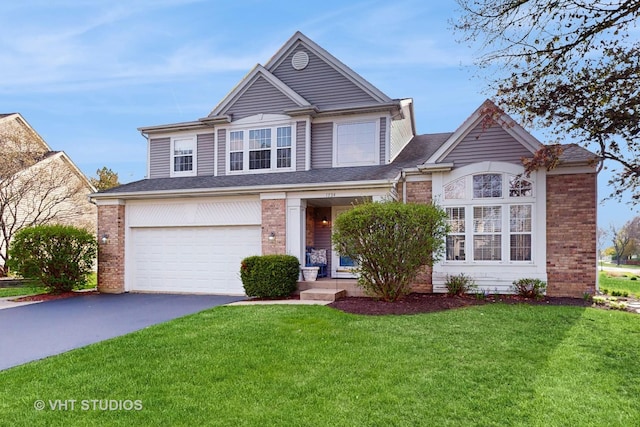 1734 Nashville Ln, Crystal Lake, IL 60014 - view of front of property with brick siding, an attached garage, driveway, and a front yard