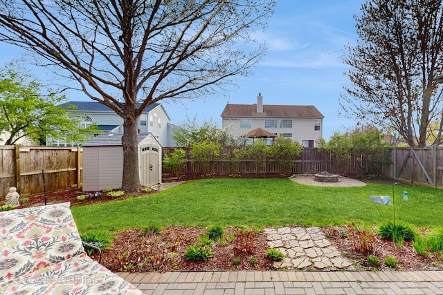 1734 Nashville Ln, Crystal Lake, IL 60014 - view of yard with a storage shed, an outdoor structure, a fire pit, and a fenced backyard