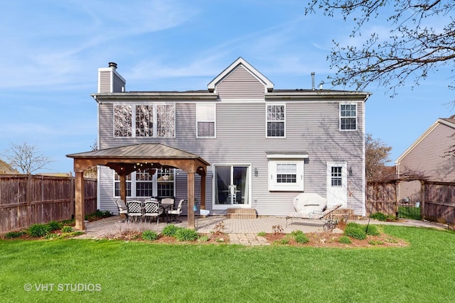 1734 Nashville Ln, Crystal Lake, IL 60014 - back of property featuring a chimney, a gazebo, a fenced backyard, a yard, and a patio