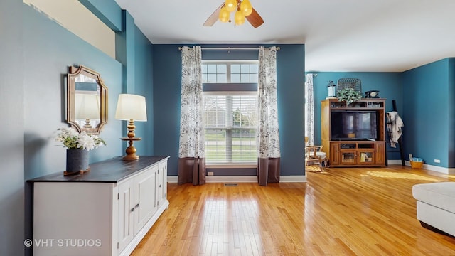 1734 Nashville Ln, Crystal Lake, IL 60014 - interior space featuring a ceiling fan, baseboards, visible vents, and light wood-style floors