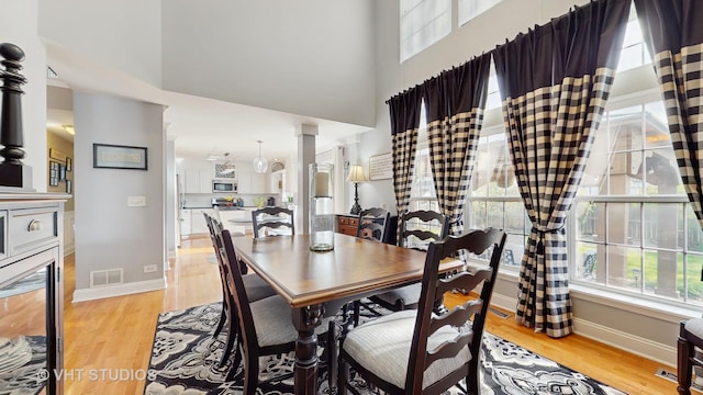 1734 Nashville Ln, Crystal Lake, IL 60014 - dining space with visible vents, a wealth of natural light, and light wood-type flooring