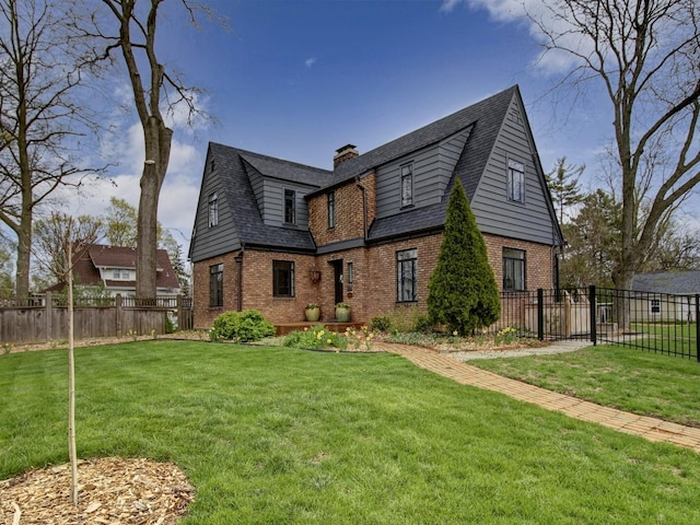517 S Washington St, Wheaton, IL 60187 - rear view of house with a chimney, brick siding, fence, and a yard