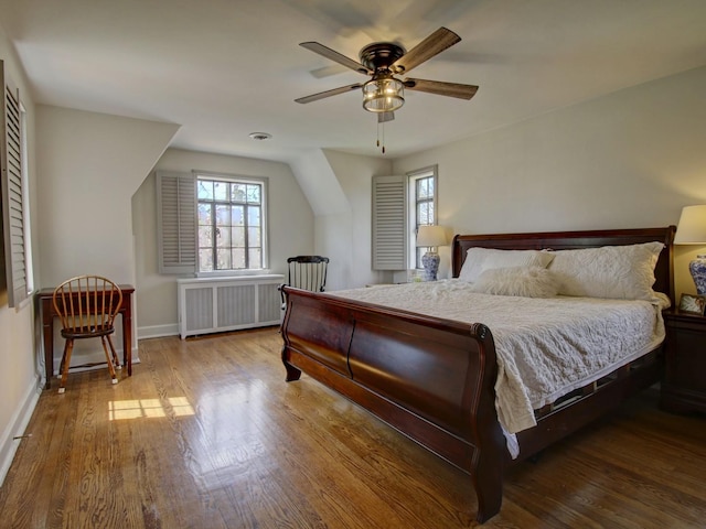 517 S Washington St, Wheaton, IL 60187 - bedroom with radiator heating unit, wood finished floors, baseboards, and ceiling fan