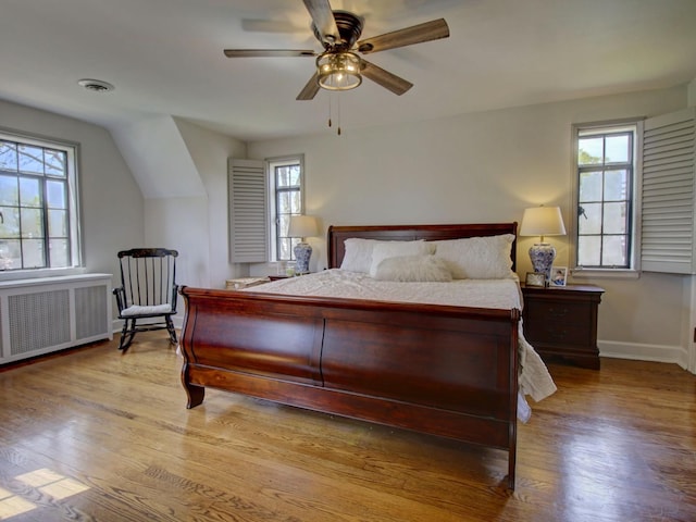517 S Washington St, Wheaton, IL 60187 - bedroom featuring visible vents, baseboards, wood finished floors, and radiator