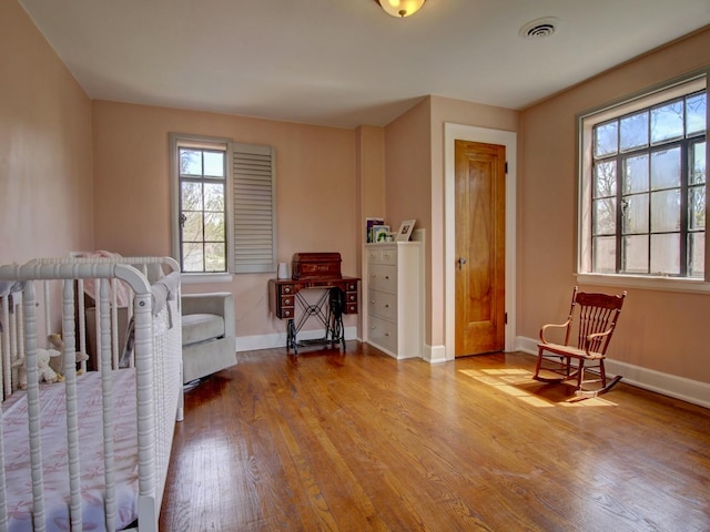 517 S Washington St, Wheaton, IL 60187 - bedroom featuring baseboards, wood finished floors, and visible vents