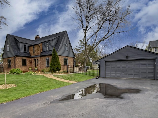 517 S Washington St, Wheaton, IL 60187 - view of side of property with a chimney, brick siding, fence, and a lawn