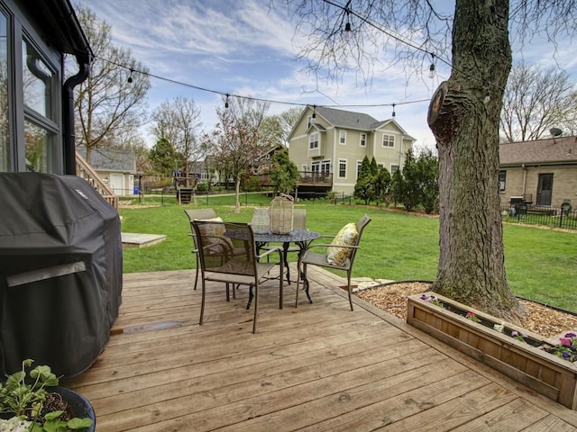 517 S Washington St, Wheaton, IL 60187 - wooden terrace featuring outdoor dining space, grilling area, fence, a yard, and a residential view