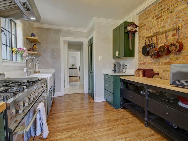 517 S Washington St, Wheaton, IL 60187 - kitchen with ventilation hood, stainless steel gas stove, open shelves, green cabinets, and light wood-style flooring