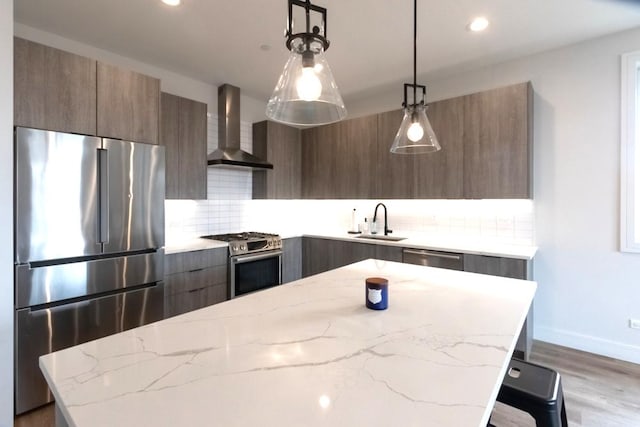 117 S Bell Ave Unit 4S, Chicago, IL 60612 - kitchen with a sink, stainless steel appliances, modern cabinets, and wall chimney exhaust hood