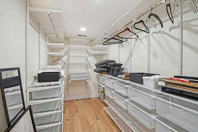 spacious closet with visible vents and wood finished floors