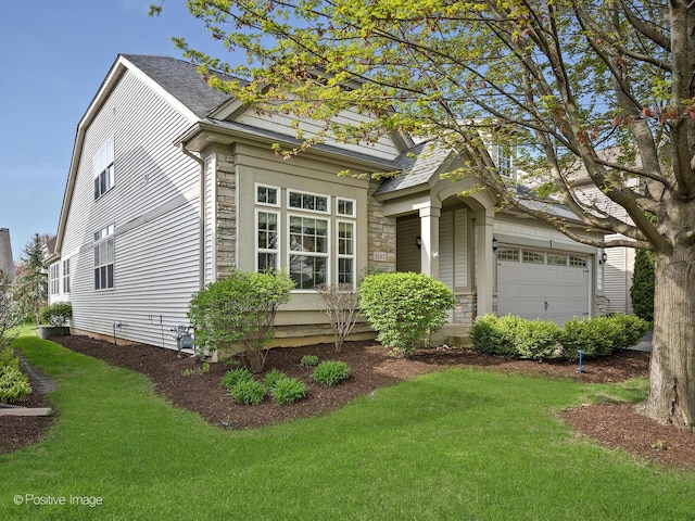 1683 Briarheath Dr, Aurora, IL 60505 - view of front of property featuring a front yard, an attached garage, and stone siding