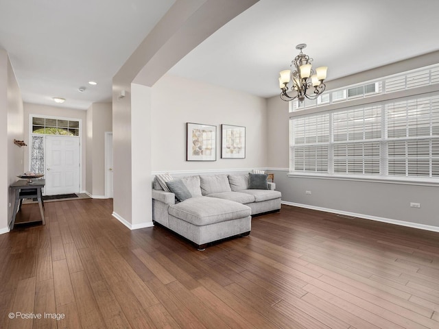 1683 Briarheath Dr, Aurora, IL 60505 - living area featuring dark wood-type flooring, recessed lighting, baseboards, and a notable chandelier