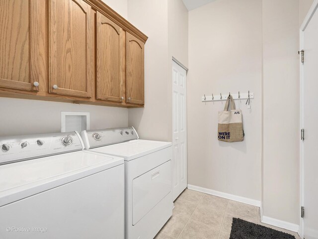 1683 Briarheath Dr, Aurora, IL 60505 - clothes washing area featuring washer and dryer, baseboards, and cabinet space