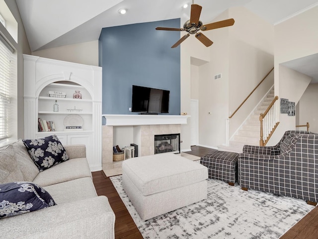1683 Briarheath Dr, Aurora, IL 60505 - living room featuring stairs, a ceiling fan, high vaulted ceiling, and dark wood finished floors