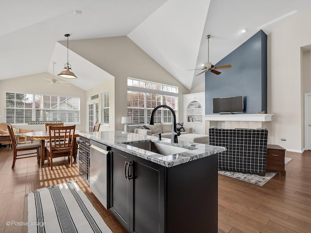 1683 Briarheath Dr, Aurora, IL 60505 - kitchen with dark cabinetry, a ceiling fan, a sink, and wood-type flooring