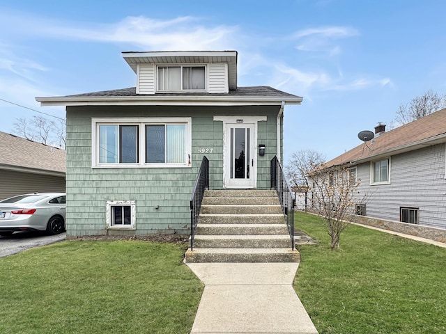 5927 W Elm Ave, Berkeley, IL 60163 - view of front of house featuring a front lawn and roof with shingles