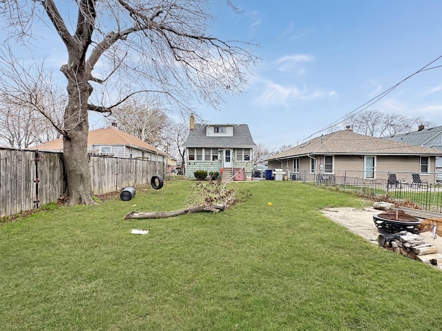5927 W Elm Ave, Berkeley, IL 60163 - view of yard featuring a fire pit and a fenced backyard