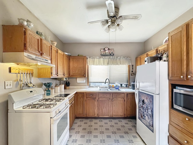 5927 W Elm Ave, Berkeley, IL 60163 - kitchen with under cabinet range hood, light floors, light countertops, a sink, and white appliances