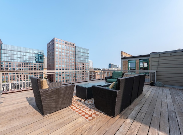wooden deck featuring outdoor lounge area and a view of city