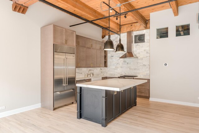 kitchen featuring wall chimney range hood, beamed ceiling, light wood-style flooring, wooden ceiling, and appliances with stainless steel finishes