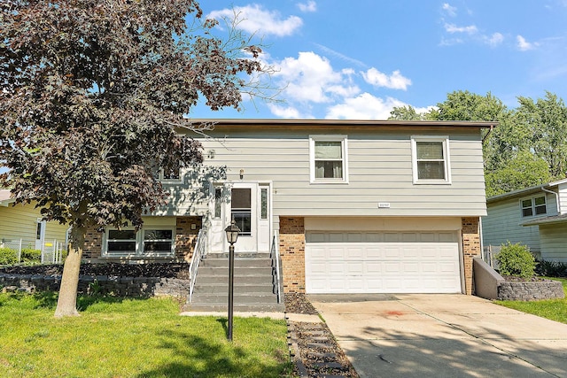 22757 Redwood Dr, Richton Park, IL 60471 - raised ranch featuring brick siding, a garage, concrete driveway, and a front yard