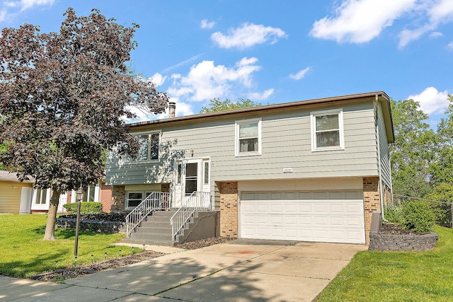 22757 Redwood Dr, Richton Park, IL 60471 - raised ranch featuring brick siding, a garage, driveway, and a front lawn